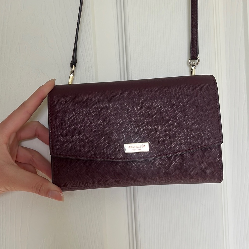 Small Purple Kate spade crossbody wallet.